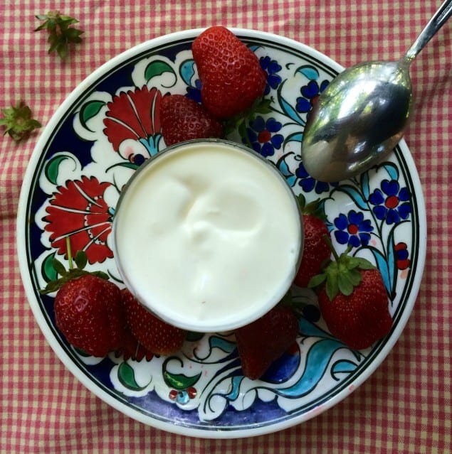 Homemade crème fraîche with strawberries
