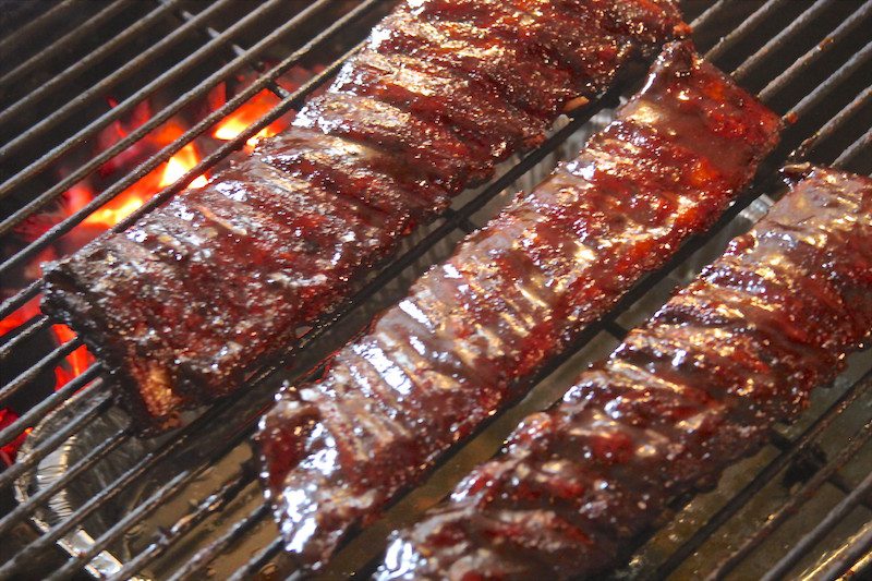 sauced ribs on grill