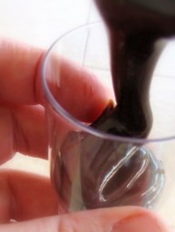 pouring spoon brigadeiro into party cups