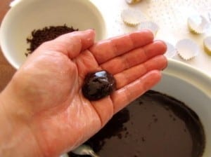 forming brigadeiro candy with buttered hands