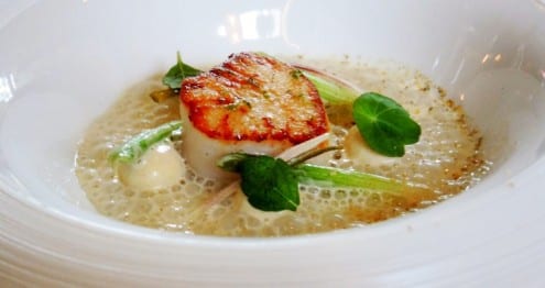 Gnudi with seared scallop served in a pool of tom yum broth at the Elm