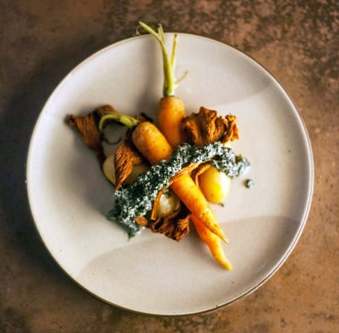 Carrots, Fingerlings and Chanterelles Cooked In Hay With Seaweed Pesto
