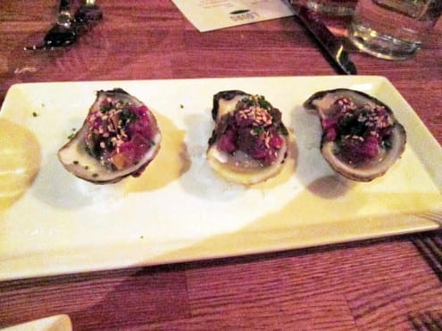 lightly pickled oyster topped with a bit of venison tartare