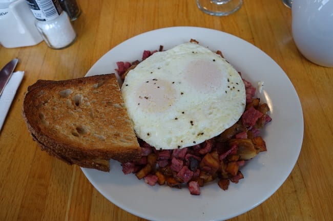 Corned beef hash served with eggs