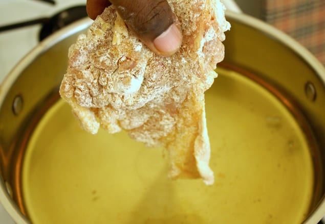 6-Chicken-Going-in-Oil The Ultimate Guide to Making Fried Chicken