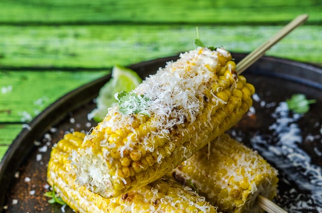 Grilled corn on the cob with lime and parmesan