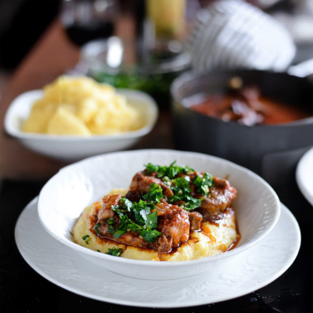 Slow braised oxtail osso buco served over cheesy polenta is the perfect comfort food for colder months. Fall off the bone oxtail, a umami-packed sauce, served on top of creamy, cheesy polenta. How lovely!