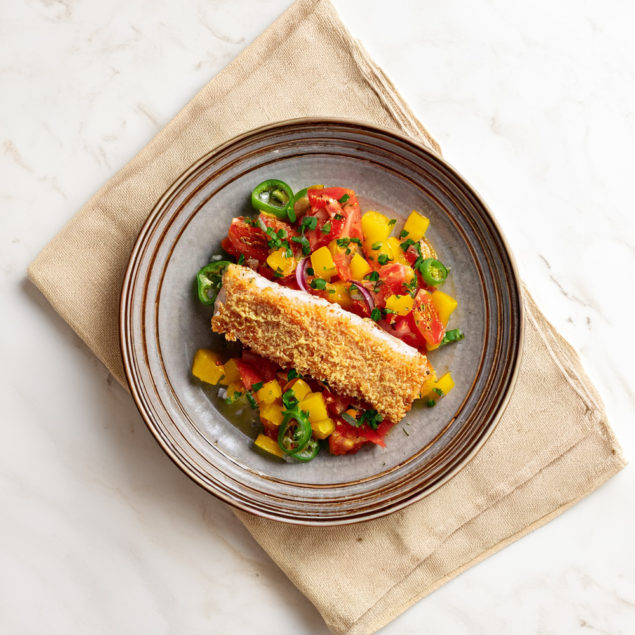 With a crispy onion and panko coating, yellowtail fillets are pan-fried and served with a fresh, tropical mango salsa and a lovely Key lime butter sauce. 