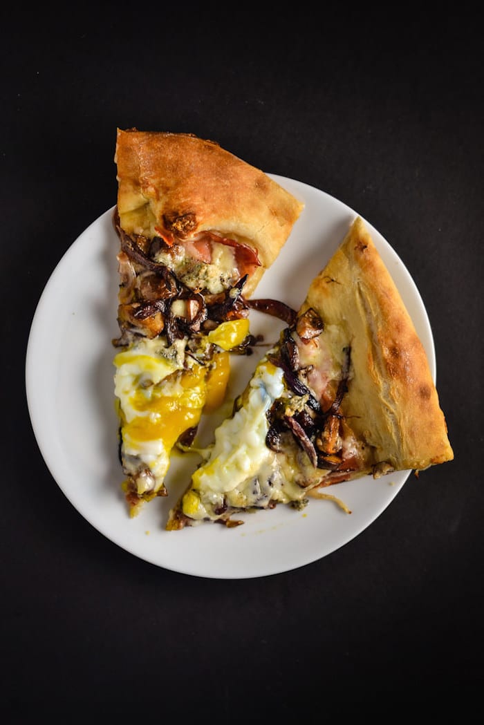 Gorgonzola, Caramelized Onion, and Prosciutto Pizza with an Egg