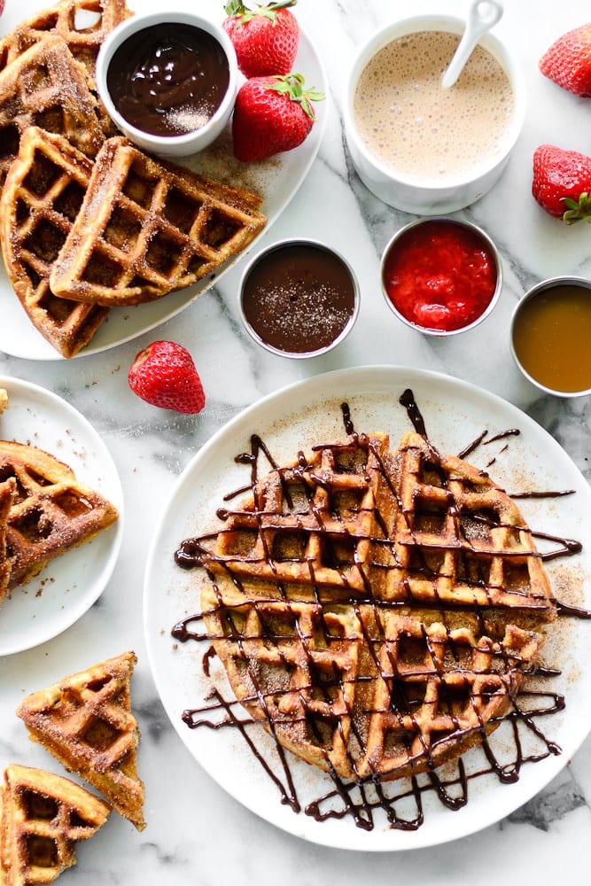 Churro Waffles with Caramel, Chocolate, and Strawberry Sauces