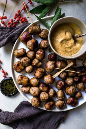 Sausage Bites Cooked in White Wine and Served with Creamy Mustard ...