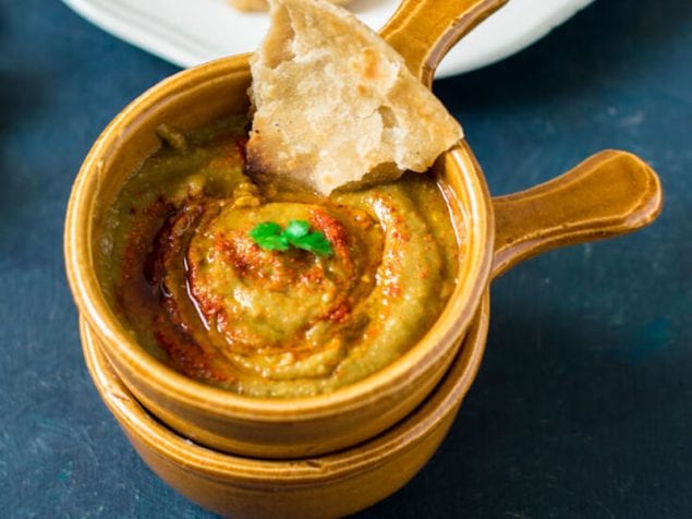 A smoky and lip-smackingly delicious eggplant dip spiced with harissa and perfect to enjoy with flaky flatbreads.