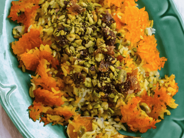 Persian rice with dates, chopped pistachios and aromatic cardamom is steamed together with an addictive and crunchy saffron crust called tahdig.