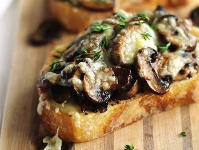 Quick and easy, these Cheesy Mustard and Mushroom Toasts are made with sautéed mushrooms with Maille Old Style Mustard, fresh thyme and melted swiss cheese. Hearty, savory and vegetarian.