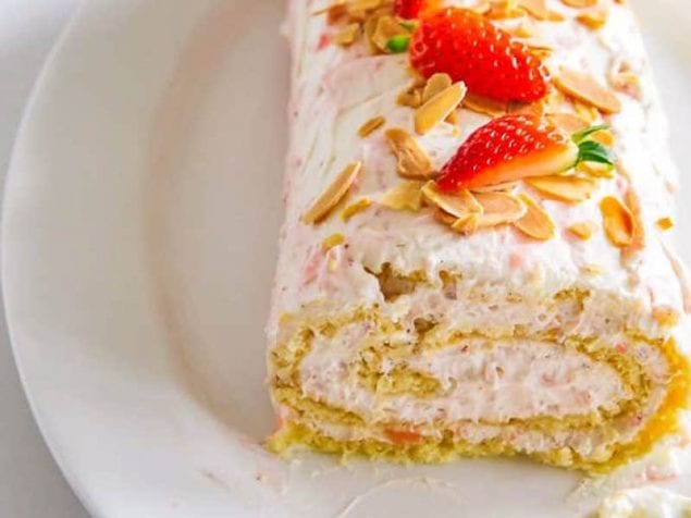 Slathered with fresh strawberry whipped cream, this Spring Strawberry Cake Roll is perfect for parties and welcoming a new season.