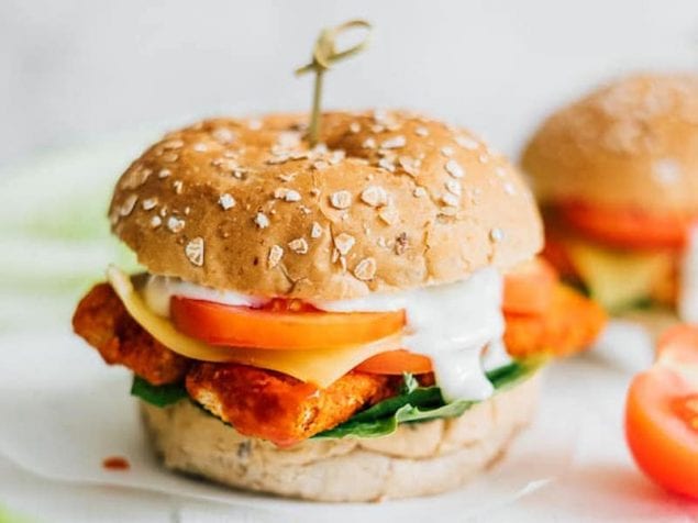 These Buffalo Tempeh Tenders Sandwiches are stuffed with crispy baked tempeh buffalo tenders, provolone cheese, and ranch dressing!