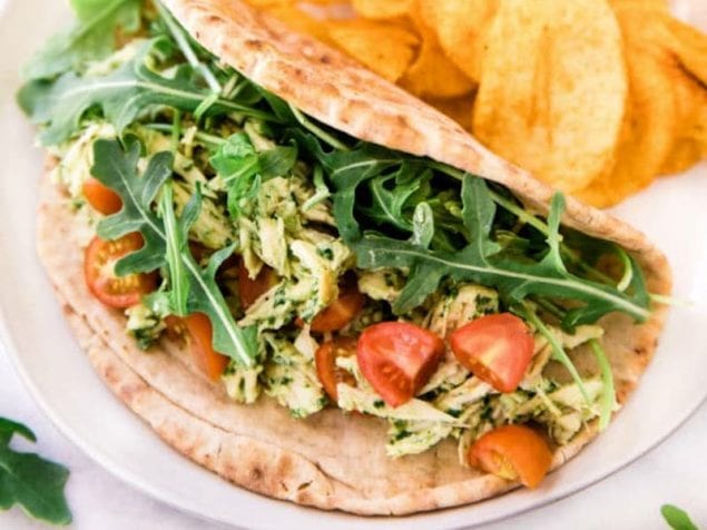 This isn't your usual chicken salad! Easy homemade arugula pesto adds big flavor to this favorite chicken salad. Layer Arugula Pesto Chicken Salad on sandwich rolls or stuff it in a pita with greens and sliced tomato for a delicious lunch.