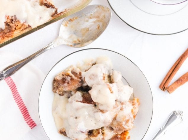 Cinnamon Bun Bread Pudding, the ooey gooey deliciousness of cinnamon buns combined with the rich decadence of bread pudding and cream cheese icing.