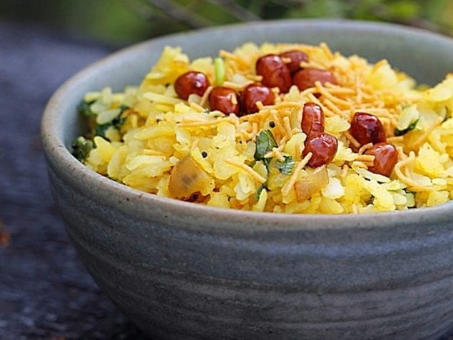 This quick and simple recipe of Flattened Rice Poha or Kanda poha is quite popular India and is a staple breakfast food in many households.