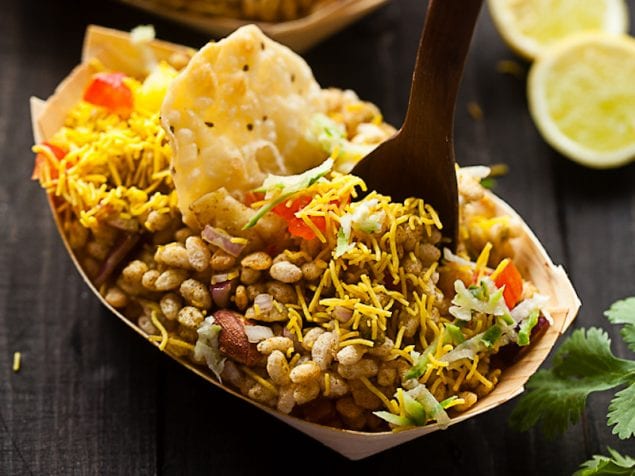 Bhel Puri is a chaat and savory snack that is traditionally made with puffed rice, vegetables, sev, chutneys and peanuts. In this case however, I have replaced the puffed rice with the rice krispie cereal for fun and easy crunch.