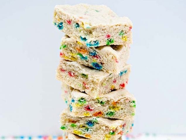 These Sheet Pan Sugar Cookie Bars are super easy to make for a crowd. Cut into squares and serve or top with ice cream. The perfect sundae addition!