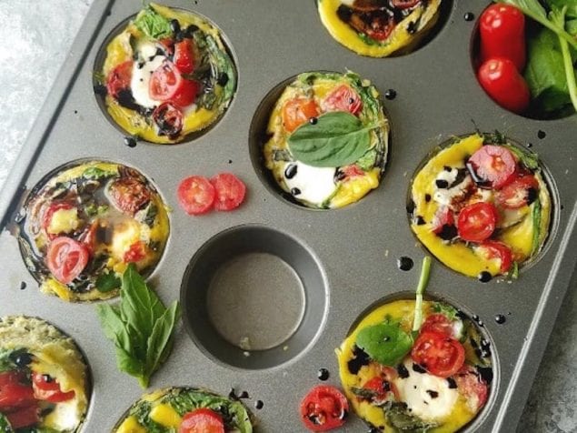 Like a frittata, but baked in a muffin pan, these Caprese Egg Cups are perfect to make ahead for breakfast with spinach, tomatoes, basil, and cheese.