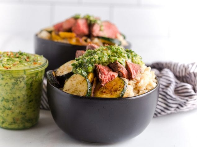 Grilled Steak and Vegetable Rice Bowls with Chimichurri Sauce are a fun and flavorful way to make grilled steak for dinner.  A bright and zippy chimichurri sauce brightens up grilled steak, along with spiced grilled veggies and fluffy rice.