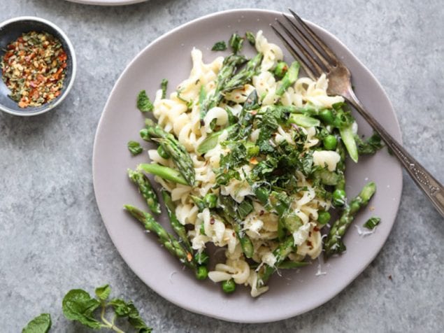 This vegetarian carbonara pasta uses yogurt to give the sauce creaminess without mounds of cheese. Instead of ham, the pasta is loaded with spring vegetables.