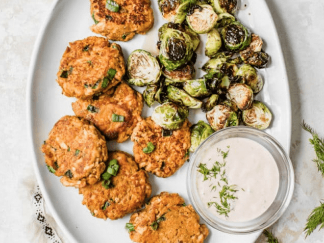 Sweet-Potato Salmon Cakes with a Creamy Sriracha-Dill Sauce, a flavor combo you will love. Sweet potato binds with flaky pan-seared salmon to create an uber-healthy sensational meal.