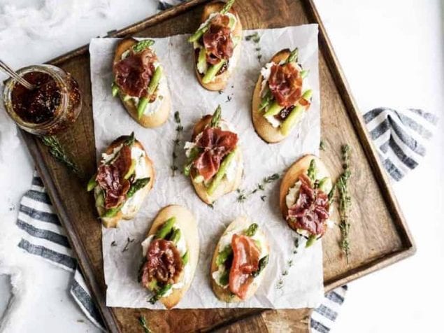 Perfect for spring, these Asparagus, Goat Cheese and Prosciutto di Parma Crostini are easy enough for a quick bite for a friend or to serve a crowd.