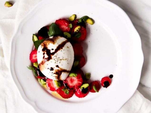 This Strawberry Burrata Salad is an easy appetizer to whip up and it is topped with pistachios, basil, and a balsamic reduction.