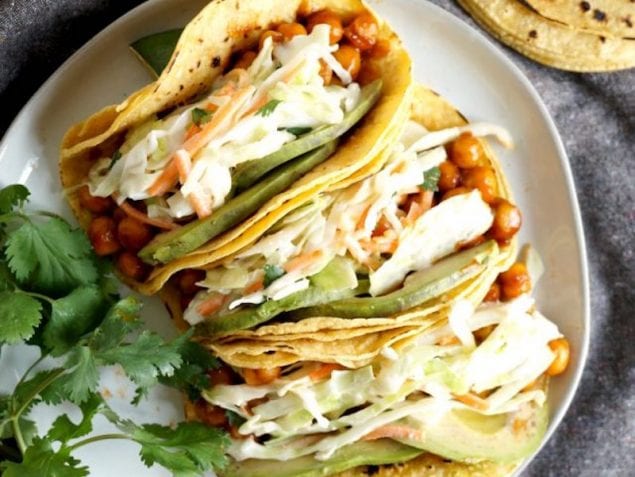 These quick and easy BBQ Chickpea Tacos are a perfect 15 minute dinner. They're smokey, savory, and topped with a fresh slaw and avocado slices.