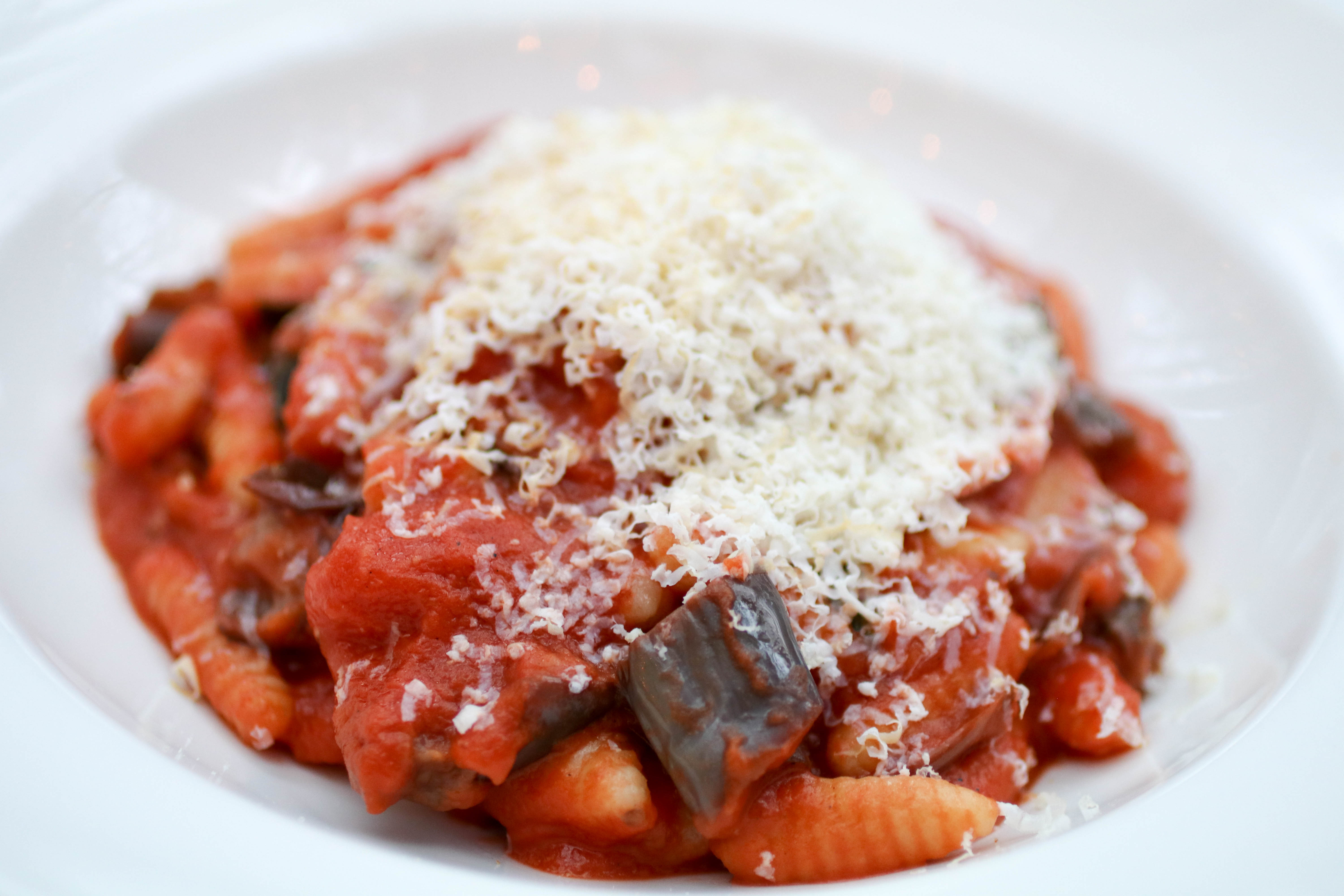 Pasta norma file- Cavatelli alla Norma, Housemade Cavatelli, Charred Eggplant, cherry tomato, Pickled Peppers, Smoked Ricotta Salata and fresh Mint