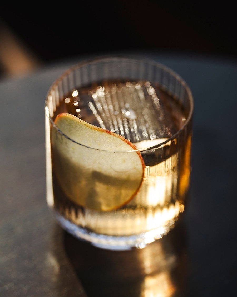 A clarified milk punch with flavors of apple, jasmine, cherry and blackcurrant is the ultimate libation at Epicurus.